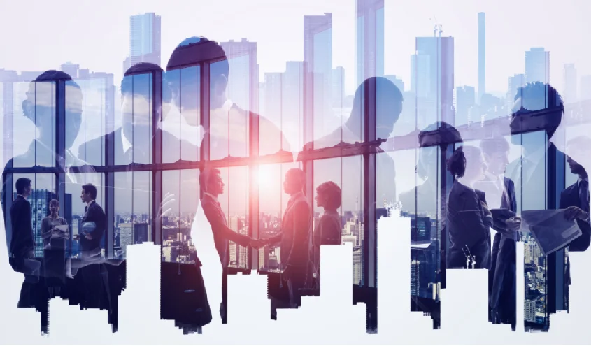 a group of people shaking hands in a room with a city behind them