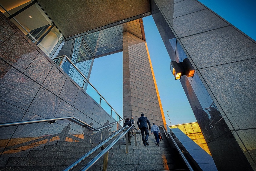 a group of people climbing up stairs