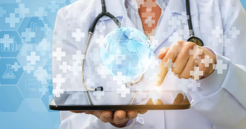 a doctor is holding a tablet with a stethoscope on it.