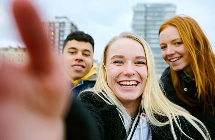 a group of friends taking a selfie.