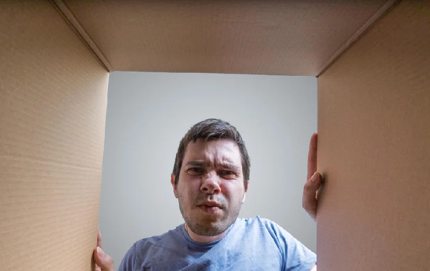 a person opening a box